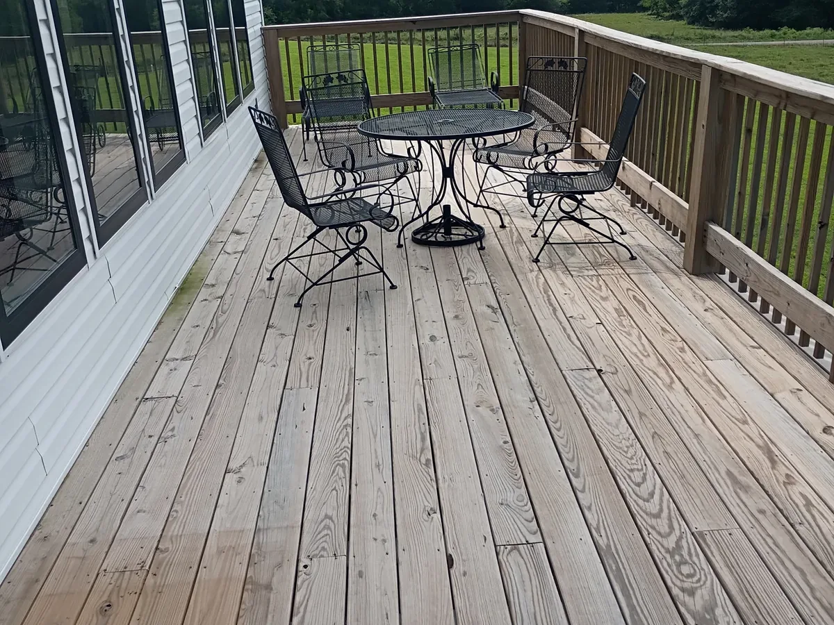 sun bleached gray deck boards before staining