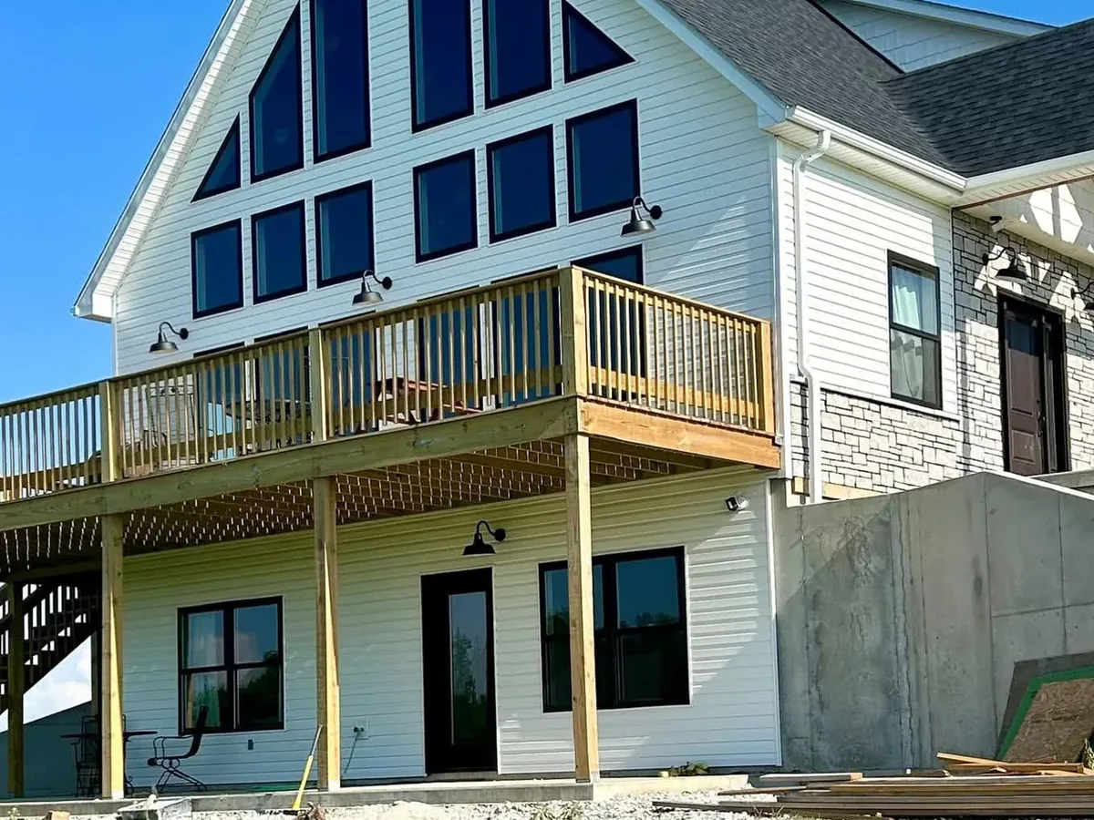 new build with unfinished raw lumber deck railings
