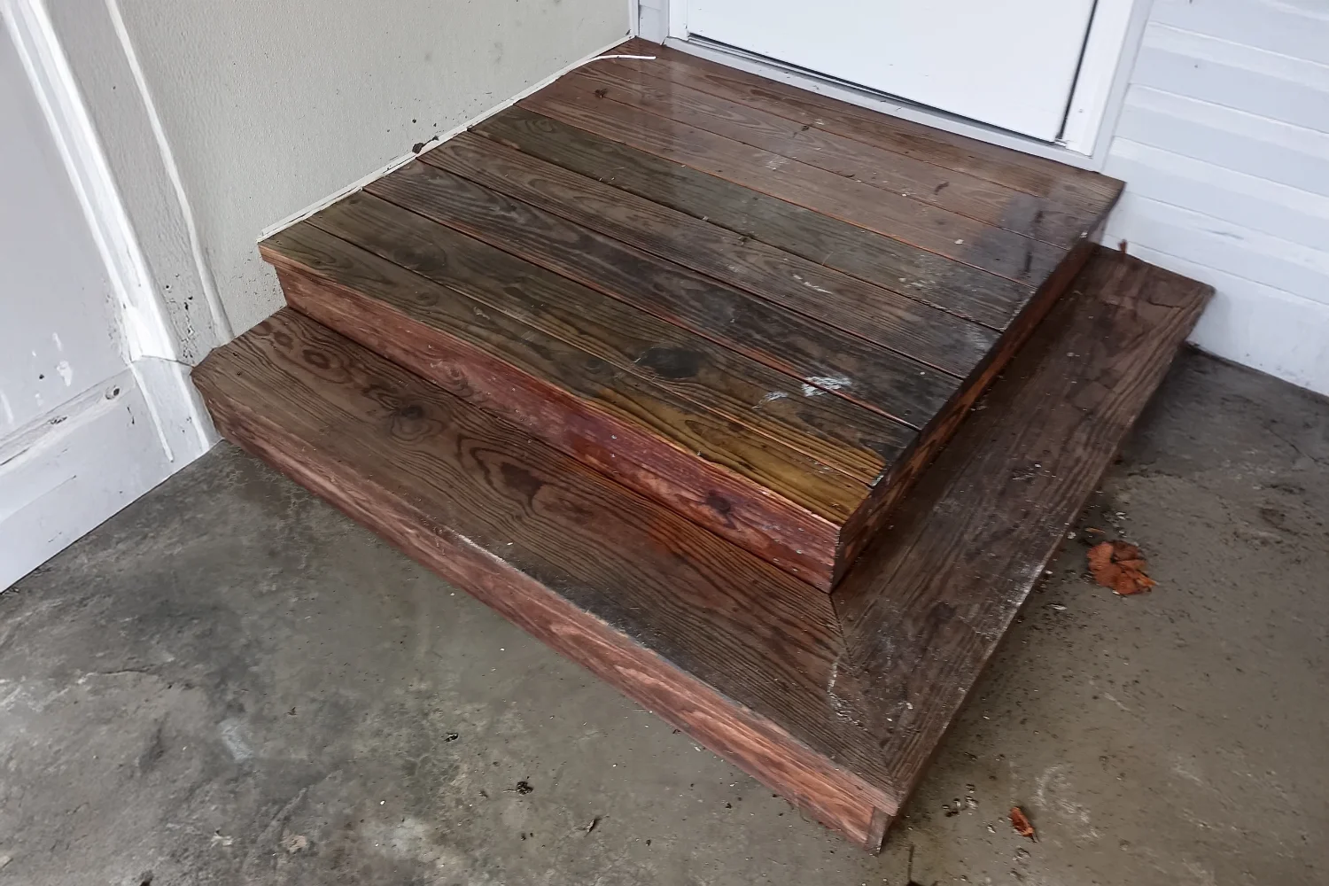 entry steps stained and weathered before treatment