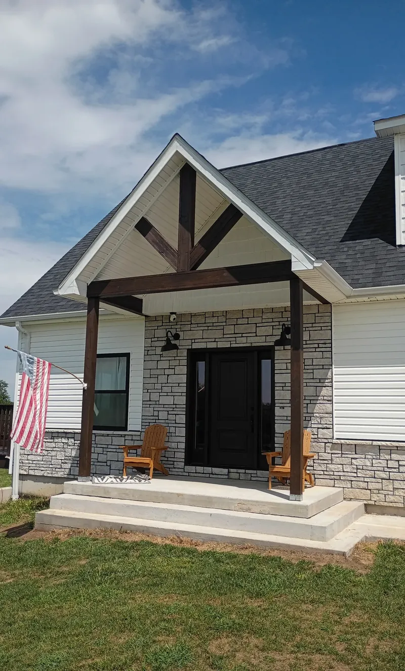 stained timber entry porch on a finished home